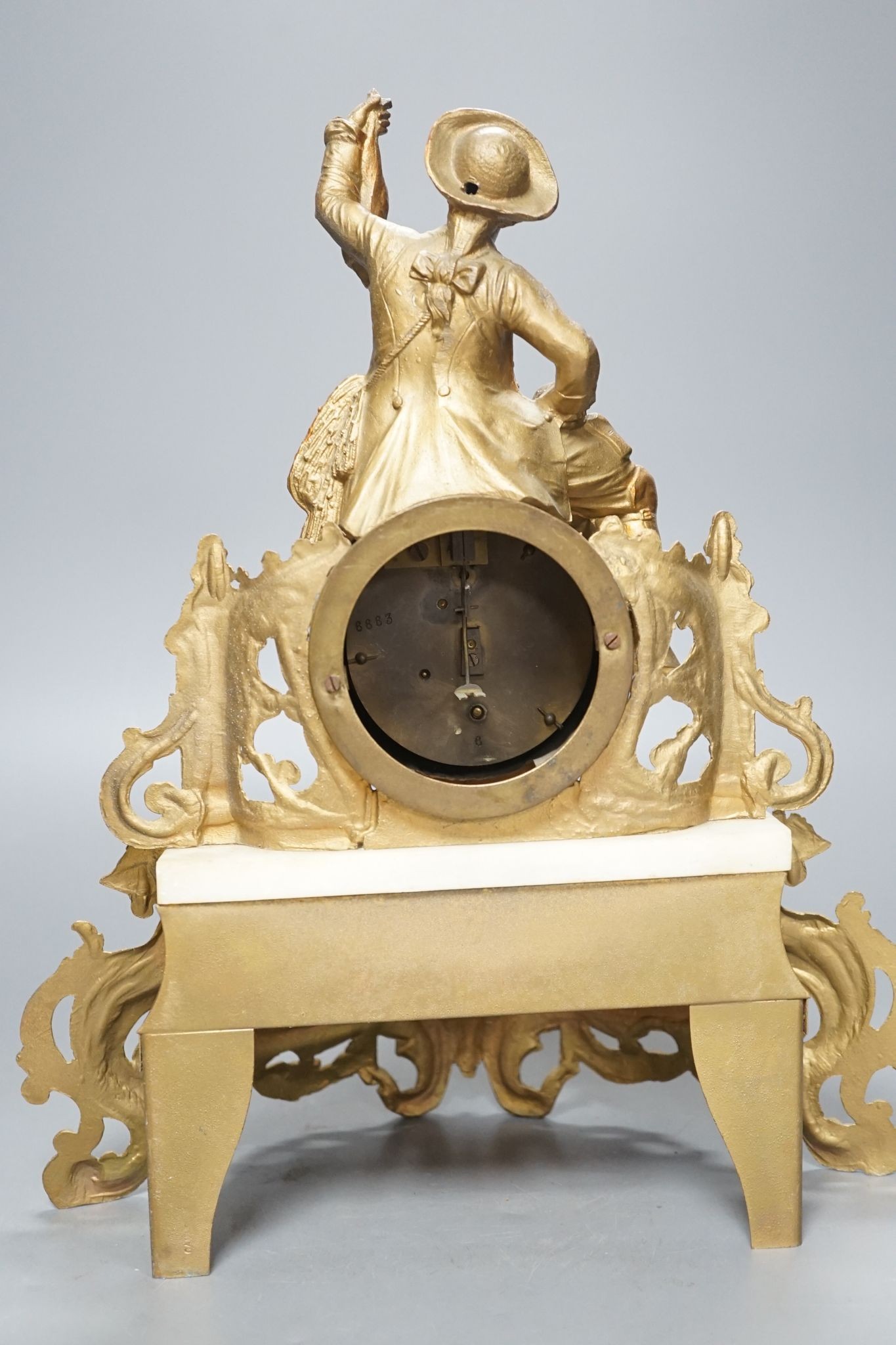 A 19th century French gilt spelter and Alabaster mantel clock, with pendulum, 36cms high.